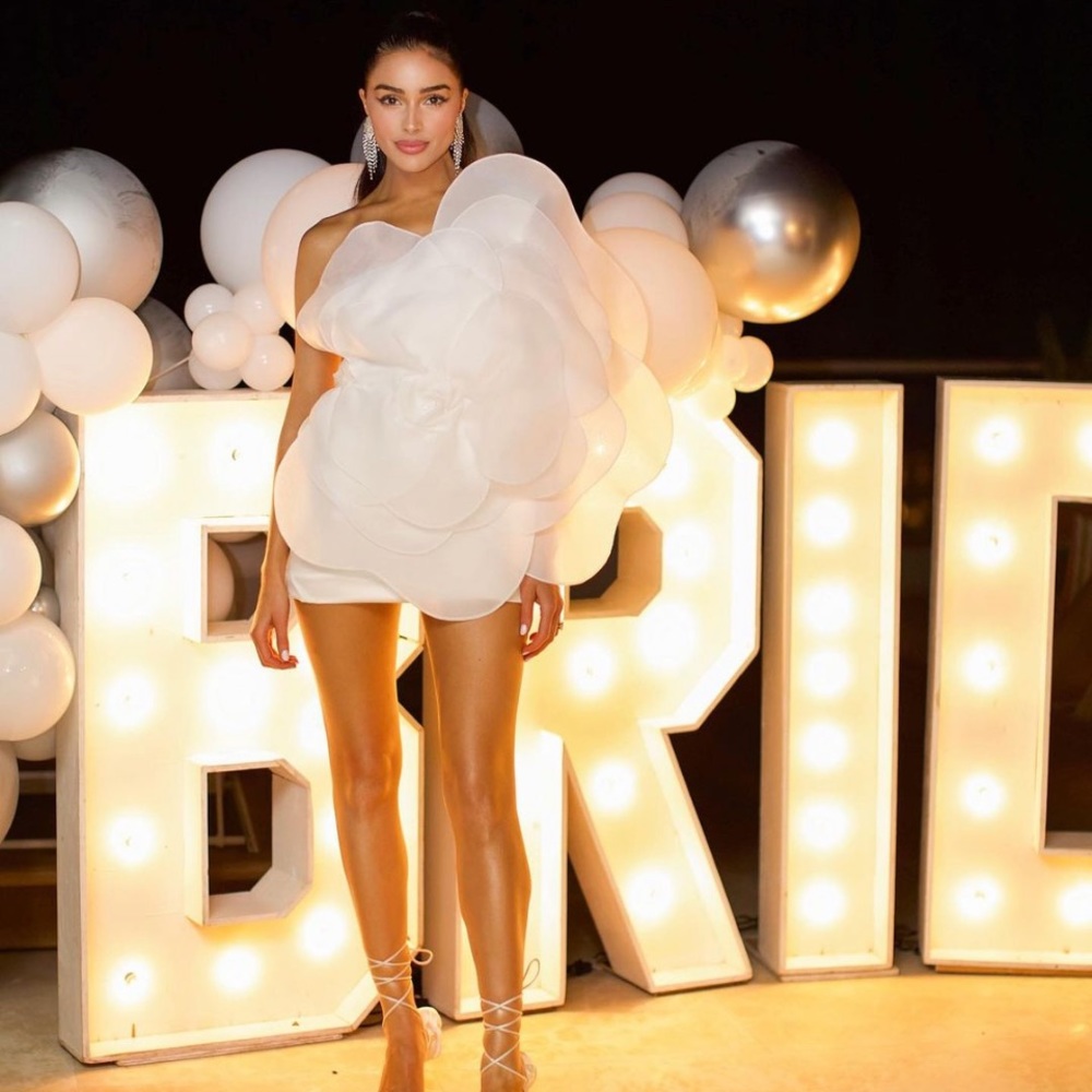 White cocktail party mini dress with a flower appliqué